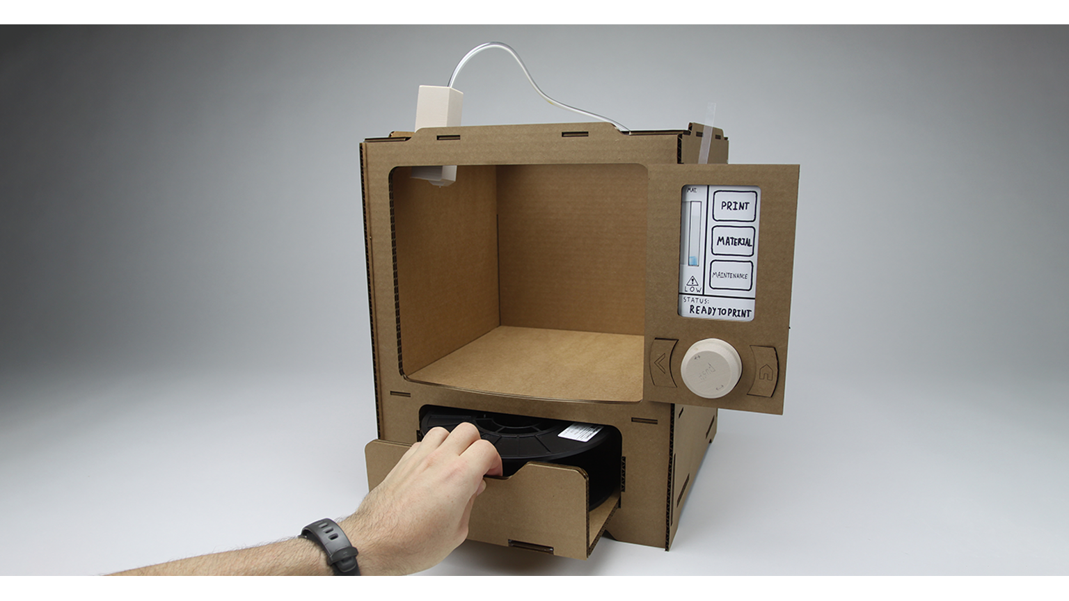 Cardboard model of a 3D printer